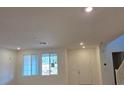 Bright and airy living room with large windows and neutral walls, ready for personalization and comfort at 3654 Stoppani Ave, Henderson, NV 89044