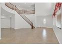 Spacious foyer with tile flooring, a staircase, and ample natural light at 3689 Bufflehead St, Las Vegas, NV 89122