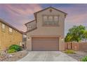 Charming home with an attached two car garage and low maintenance desert landscaping at 389 Fringe Ruff Dr, Las Vegas, NV 89148