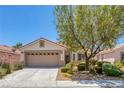 Charming single-story home with well-maintained front yard, mature shade tree, and two-car garage at 4369 Meadowlark Wing Way, North Las Vegas, NV 89084