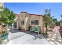 Relaxing backyard with patio space, seating and mature trees providing ample shade at 4428 Los Reyes Ct, Las Vegas, NV 89121