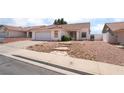 Charming single-story home featuring a two-car garage and low maintenance desert landscaping at 521 Landra Ln, Henderson, NV 89015