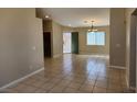 Open-concept living and dining area features tile flooring and ample natural light at 5605 Midnight Breeze St, North Las Vegas, NV 89081