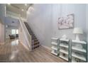 Bright foyer with high ceilings, elegant staircase, and stylish decor at 5619 Shadow Bend Dr, Las Vegas, NV 89135
