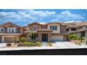 Charming two-story home with well-manicured lawn and inviting facade at 5619 Shadow Bend Dr, Las Vegas, NV 89135