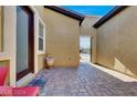 Private courtyard featuring stylish brick pavers and an entry gate with secure access to the property at 7036 Winstar St, Las Vegas, NV 89131