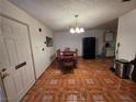 Dining room showcasing tile flooring and a view into the kitchen at 7108 Moon Ct, Las Vegas, NV 89145