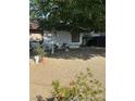 Landscaped front yard with mature tree providing lots of shade to the home at 712 Donner St, Las Vegas, NV 89107