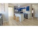 Bright kitchen with white countertops, a kitchen island, and stainless steel appliances at 920 Biltmore Dr, Las Vegas, NV 89101