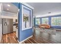 Bright living room with hardwood floors, comfortable seating, and view into the kitchen at 979 Coatbridge St, Las Vegas, NV 89145