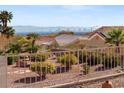 Landscaped backyard offers serene views of the city skyline, enhancing the property's appeal at 10921 Grand Haven Ave, Las Vegas, NV 89134