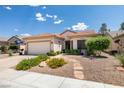 Inviting front yard with stone pathway and low-maintenance landscaping leading to the front door at 2111 Tiger Links Dr, Henderson, NV 89012