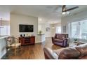 Spacious living room with hardwood floors, ceiling fan and great natural lighting at 2111 Tiger Links Dr, Henderson, NV 89012