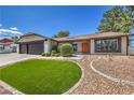 Lovely single-story home featuring a meticulously landscaped front yard, decorative rock, and a charming front door at 2504 La Solana Way, Las Vegas, NV 89102