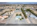 Expansive desert property featuring a single-story home, desert landscaping, and neighborhood views at 3580 S Shawnee Ave, Pahrump, NV 89048