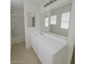 Clean bathroom with vanity, sink, large mirror and shower-tub combo at 520 Shire Hall St, Las Vegas, NV 89178