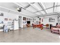 Spacious three-car garage equipped with a pool table and ample room for activities at 690 Great Dane Ct, Henderson, NV 89052
