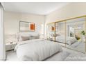 Serene main bedroom with mirrored closet, a plush bed, and a sliding glass door to a private outdoor space at 727 Heritage Vista Ave, Henderson, NV 89015
