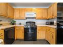 Well-lit kitchen featuring gas stove, microwave, and dishwasher at 7288 Quarterhorse Ln, Las Vegas, NV 89148
