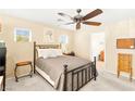Inviting main bedroom featuring neutral decor, cozy carpet, and a comfortable queen-size bed at 8316 Mokena Ave, Las Vegas, NV 89178
