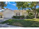Inviting single-story home featuring well-maintained landscaping and a tile roof at 8981 Rivers Edge Dr, Las Vegas, NV 89117