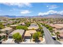 Expansive aerial view of a residential community with mountain views at 913 Hickory Park St, Las Vegas, NV 89138