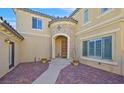 Stunning front entrance featuring a brick walkway and arched doorway at 10001 Blairwood Ct, Las Vegas, NV 89178