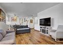 Spacious living room with wood floors and lots of natural light at 1008 Welkin St, Henderson, NV 89052