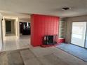 A red brick fireplace stands out in this living room area, complemented by tile flooring at 1674 Seneca Ln, Las Vegas, NV 89169