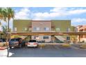 Building exterior with covered parking, well-maintained landscaping, and convenient stair access to upper levels at 1812 N Decatur Blvd # 103, Las Vegas, NV 89108