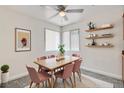 Charming dining room with modern lighting, pink chairs, and decorative wall art at 1846 N Decatur Blvd # 104, Las Vegas, NV 89108