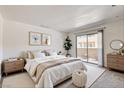 Serene main bedroom with balcony access and minimalist decor at 1846 N Decatur Blvd # 104, Las Vegas, NV 89108