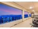 Spacious balcony with scenic city views, iron railings, and comfortable seating, perfect for relaxation at 230 Cactus Sunrise St, Las Vegas, NV 89138