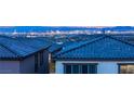 Stunning city views from atop a neighborhood, showcasing bright lights against a majestic mountainous backdrop at 230 Cactus Sunrise St, Las Vegas, NV 89138