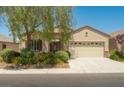 Inviting front exterior with lush landscaping and secure gated entry at 2486 Divine Sky Dr, Henderson, NV 89044