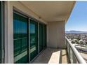 Balcony features sliding glass doors offering city views at 322 Karen Ave # 1106, Las Vegas, NV 89109