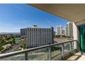 Balcony view showcases city buildings, lush landscapes, and a beautiful golf course at 322 Karen Ave # 1106, Las Vegas, NV 89109