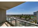Balcony view overlooking city buildings, lush landscapes, and a beautiful golf course at 322 Karen Ave # 1106, Las Vegas, NV 89109