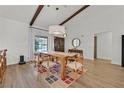 Bright dining room with wood floors, wooden table, pendant lighting and exposed beams on the ceiling at 3220 Calle De El Cortez, Las Vegas, NV 89102