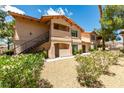 View of the condo showcasing its architecture and well-maintained landscaping at 350 S Durango Dr # 103, Las Vegas, NV 89145
