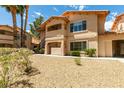 Attractive condo exterior features a balcony and lush greenery at 350 S Durango Dr # 103, Las Vegas, NV 89145