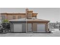 Charming townhouse featuring a two-car garage, well-maintained landscaping, and inviting entryway at 3608 Quetonia St # 204, Las Vegas, NV 89108
