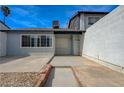 Private backyard with concrete patio perfect for relaxing or entertaining with brick planter and white brick fence at 3924 Blackford Pl, Las Vegas, NV 89102