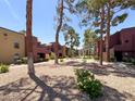Landscaped grounds with mature trees and bushes offering a private outdoor living experience at 4050 Pacific Harbors Dr # 224, Las Vegas, NV 89121