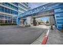 Exterior shot of the building entrance showing covered drop-off and blue facade at 4525 Dean Martin Dr # 2903, Las Vegas, NV 89103