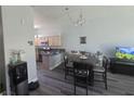 Cozy dining area open to kitchen with modern appliances and a view of living area at 4764 Wild Draw Dr, North Las Vegas, NV 89031