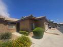 A beautifully landscaped single-story home with a welcoming entrance and well-maintained yard at 4764 Wild Draw Dr, North Las Vegas, NV 89031