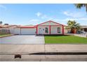 Charming single-story home featuring a well-maintained front yard and ample parking at 5375 Chestnut St, Las Vegas, NV 89119