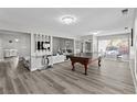 Spacious living room featuring a billiards table and modern design elements at 5375 Chestnut St, Las Vegas, NV 89119