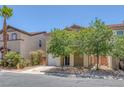 Charming home featuring desert landscaping, a two-car garage, and neutral-toned exterior at 589 Brinkburn Point Ave, Las Vegas, NV 89178